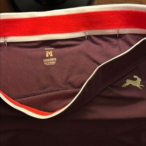 Tracksmith Maroon capri leggings  with Red and White Trim.